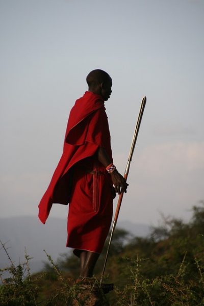 A stereotypical image is that of a Maasai clad in a shuka standing tall and slender in stylish long ochre-dyed hair with a spear clutched in hand