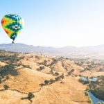 Passengers are actively encouraged to help crew and the pilot with the pre-flight inflation before a hot air balloon safari