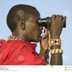https://www.megapixl.com/masai-scout-with-binoculars-looks-for-animals-during-a-tourist-game-drive-at-the-lewa-wildlife-conservancy-in-north-kenya-africa-stock-photo-52319221