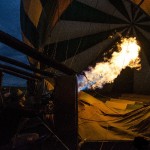 Hot-air balloon basket has secure rope handles for use during landing and take-off