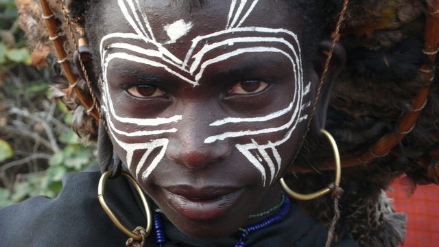 Three Maasai men wearing the distinctive shuka cloth in Kenya