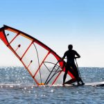Windsurfer picks up the sail