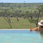 Naboisho guest enjoying the views from the swimming pool
