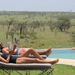 Naboisho guests lounging around the swimming pool