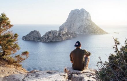 https://www.pexels.com/photo/rear-view-of-man-sitting-on-rock-by-sea-307008/